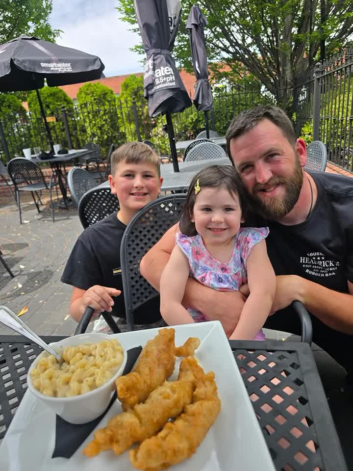Owner and chef Cody Headrick with his family on the Headrick's patio